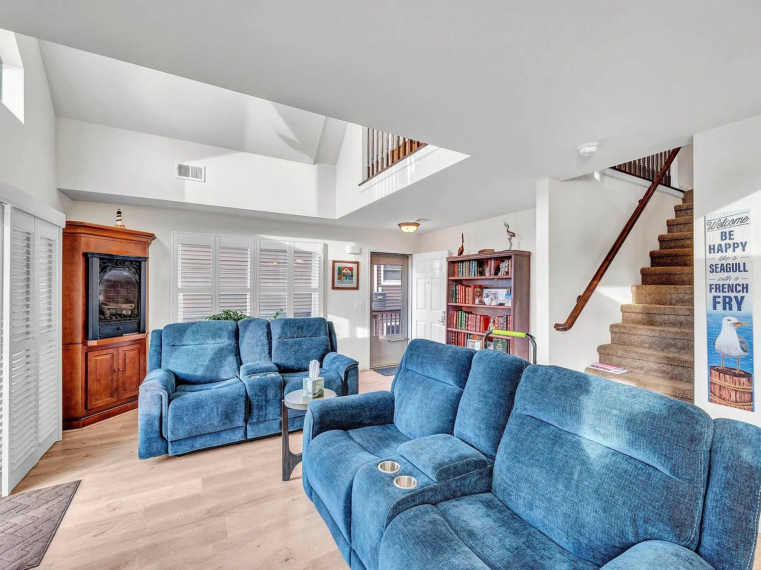 Open living room looking up to the loft