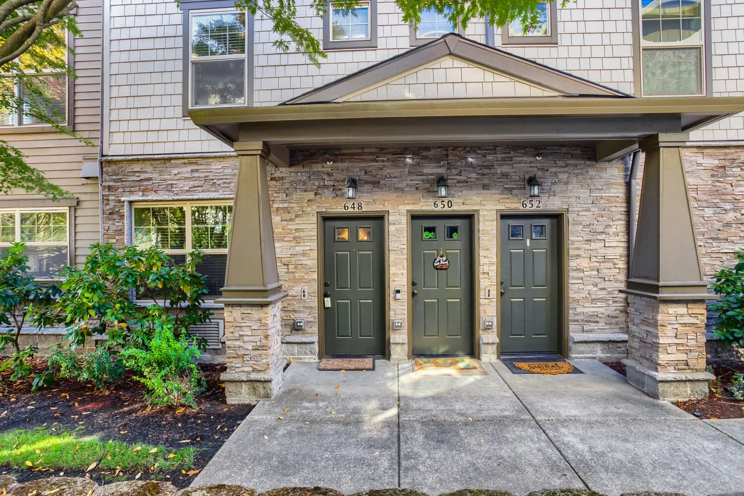 Front entry with house number 648 at 648 NE Adwick Dr, Hillsboro, OR
