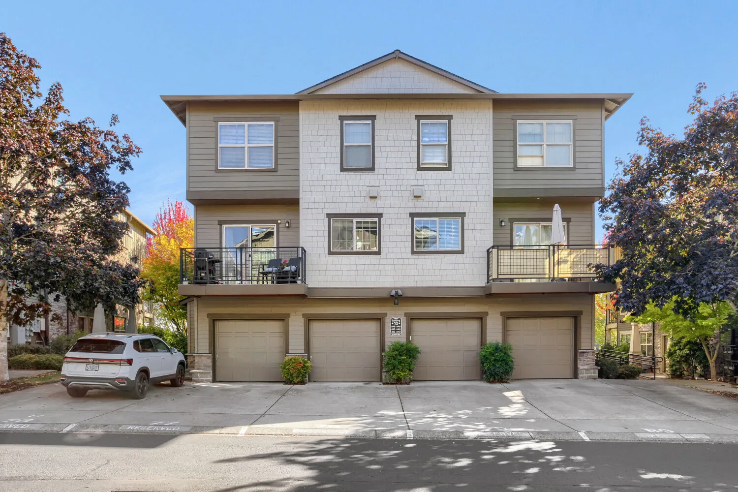 Exterior facade with garages and balconies at 648 NE Adwick Dr, Hillsboro, OR