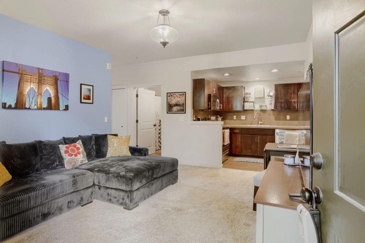 Entryway opening into the living room and kitchen at 648 NE Adwick Dr, Hillsboro, OR