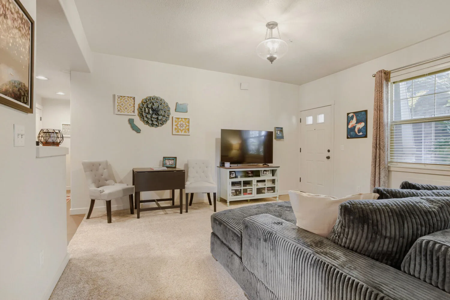 Living room looking toward the front entrance at 648 NE Adwick Dr, Hillsboro, OR