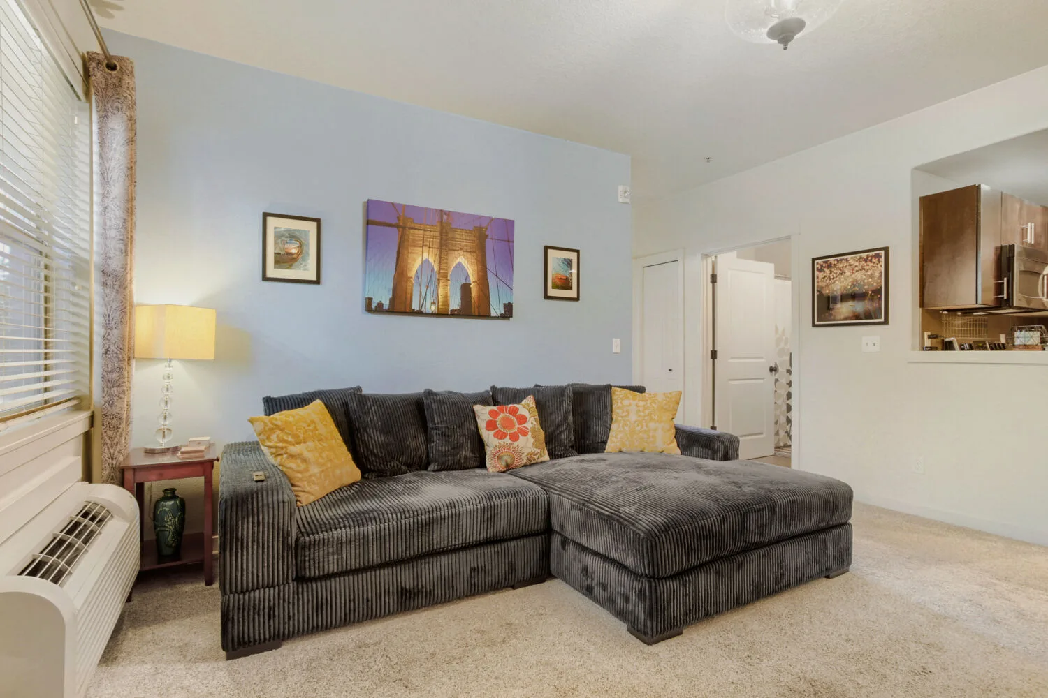 Living room with blue accent wall at 648 NE Adwick Dr, Hillsboro, OR