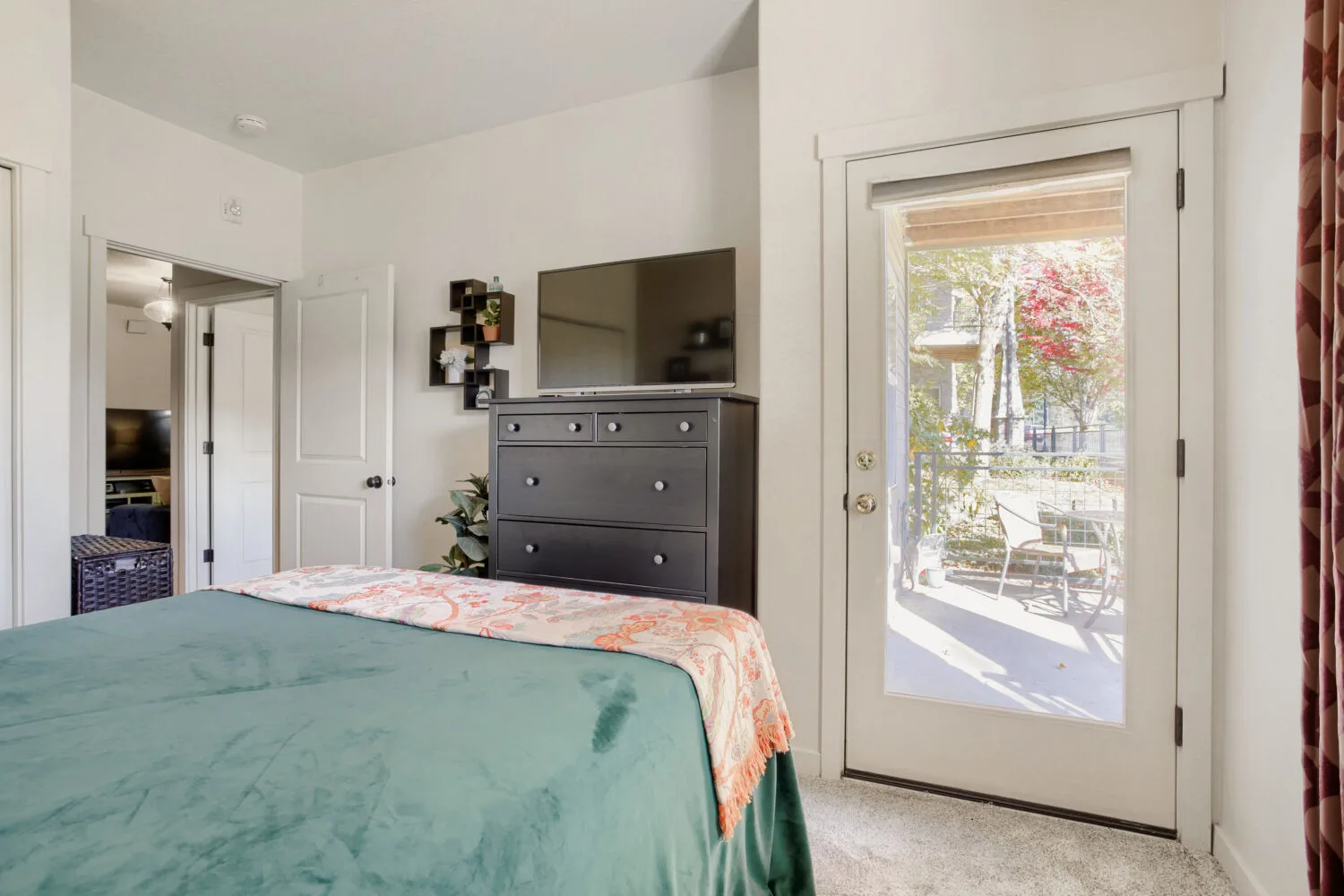 Bedroom with patio access at 648 NE Adwick Dr, Hillsboro, OR