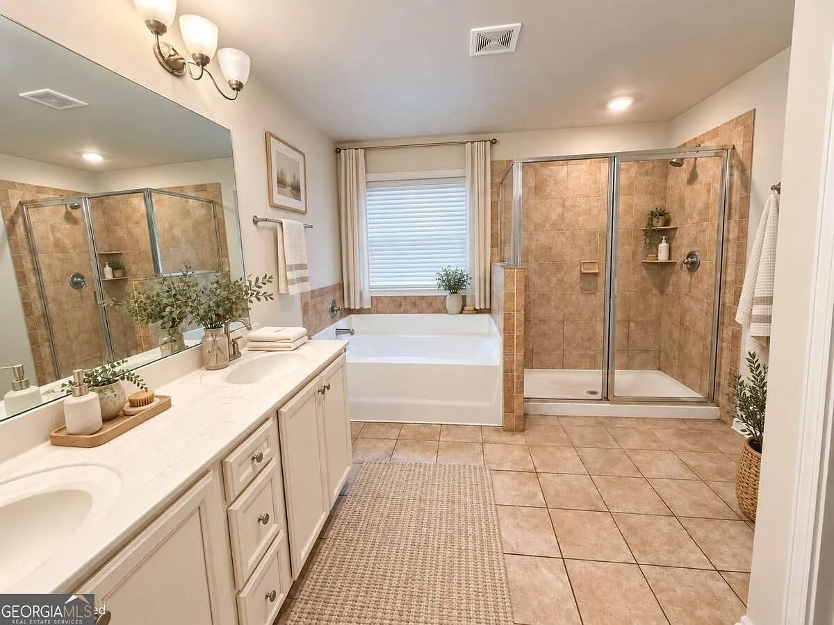 Primary bathroom with dual vanity, glass-enclosed shower and soaking tub