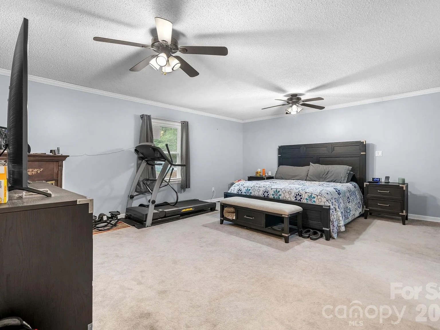 Primary bedroom at 4690 Worth Pl with neutral carpeting and light grey walls
