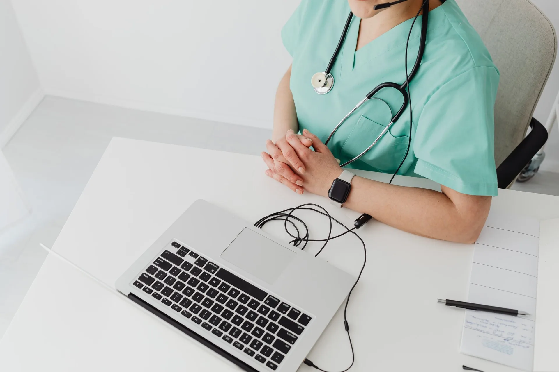 A consultation desk with a laptop and stethoscope, ready for a telehealth visit at TruHealth
