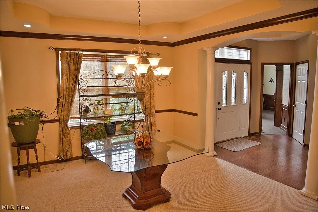 Dining room looking toward the entryway with crown molding