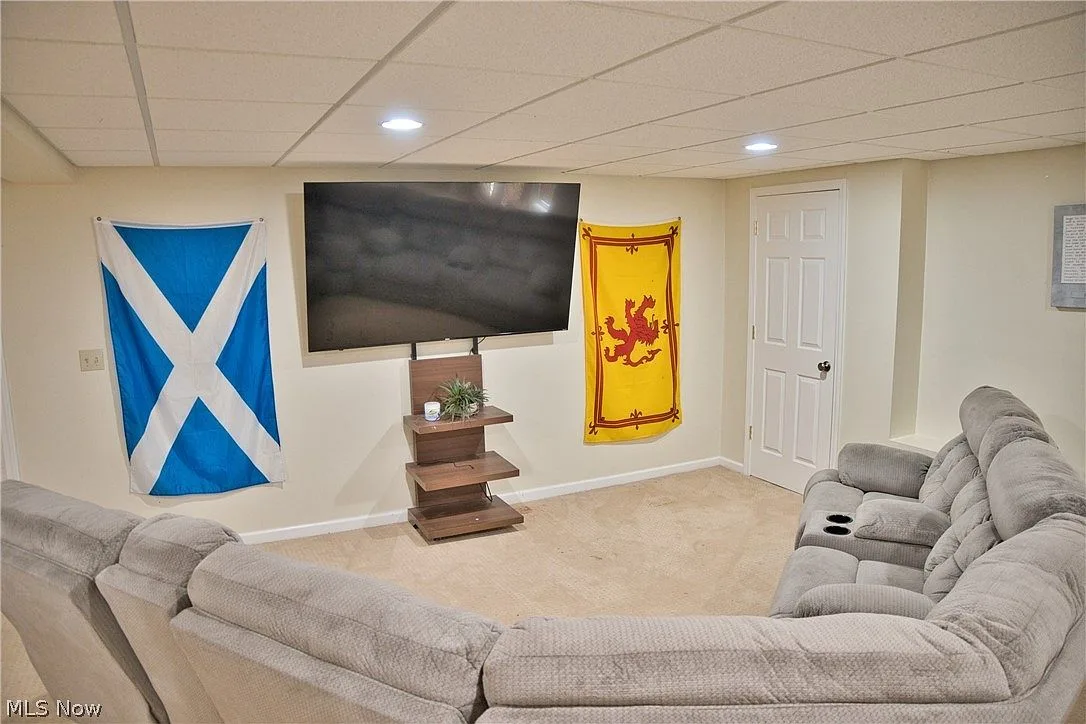 Finished basement recreation room with recessed lighting