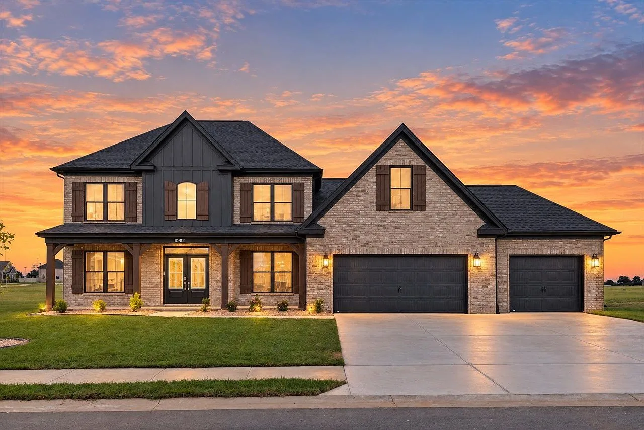 Front exterior at sunset of the featured home at 10312 Haverhill St, Bowling Green, KY