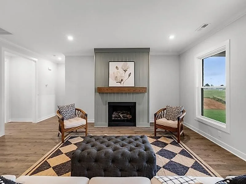 Family room fireplace with wood mantel