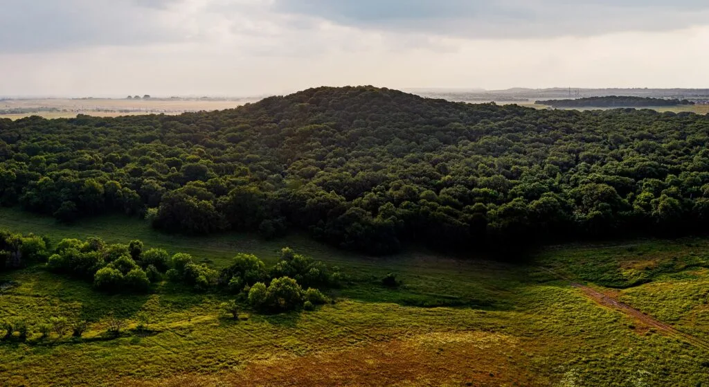 Open countryside and wooded hills in Denton County between Argyle and Justin, Texas