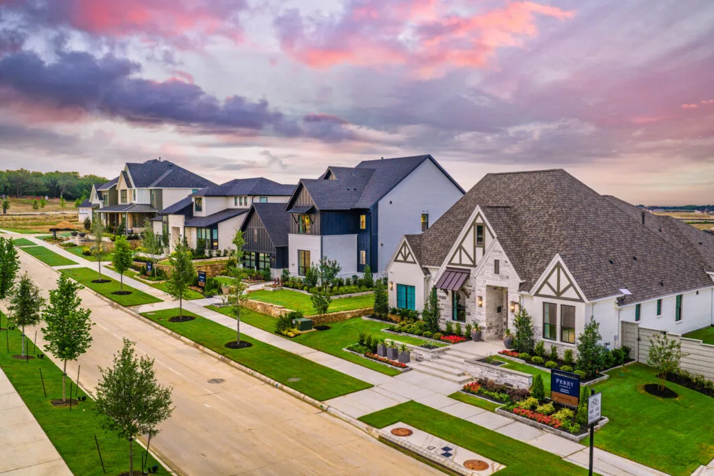 Aerial view of a North Texas street of new homes at sunset