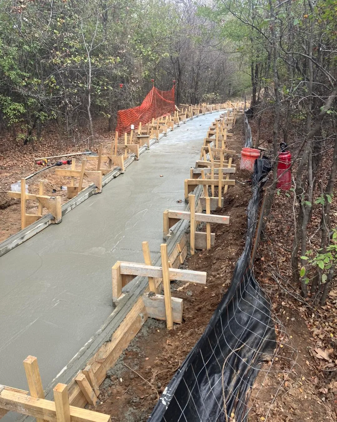 Concrete pathway under construction at the Argyle Nature Trail site in Argyle, with wooden formwork alongside the poured path