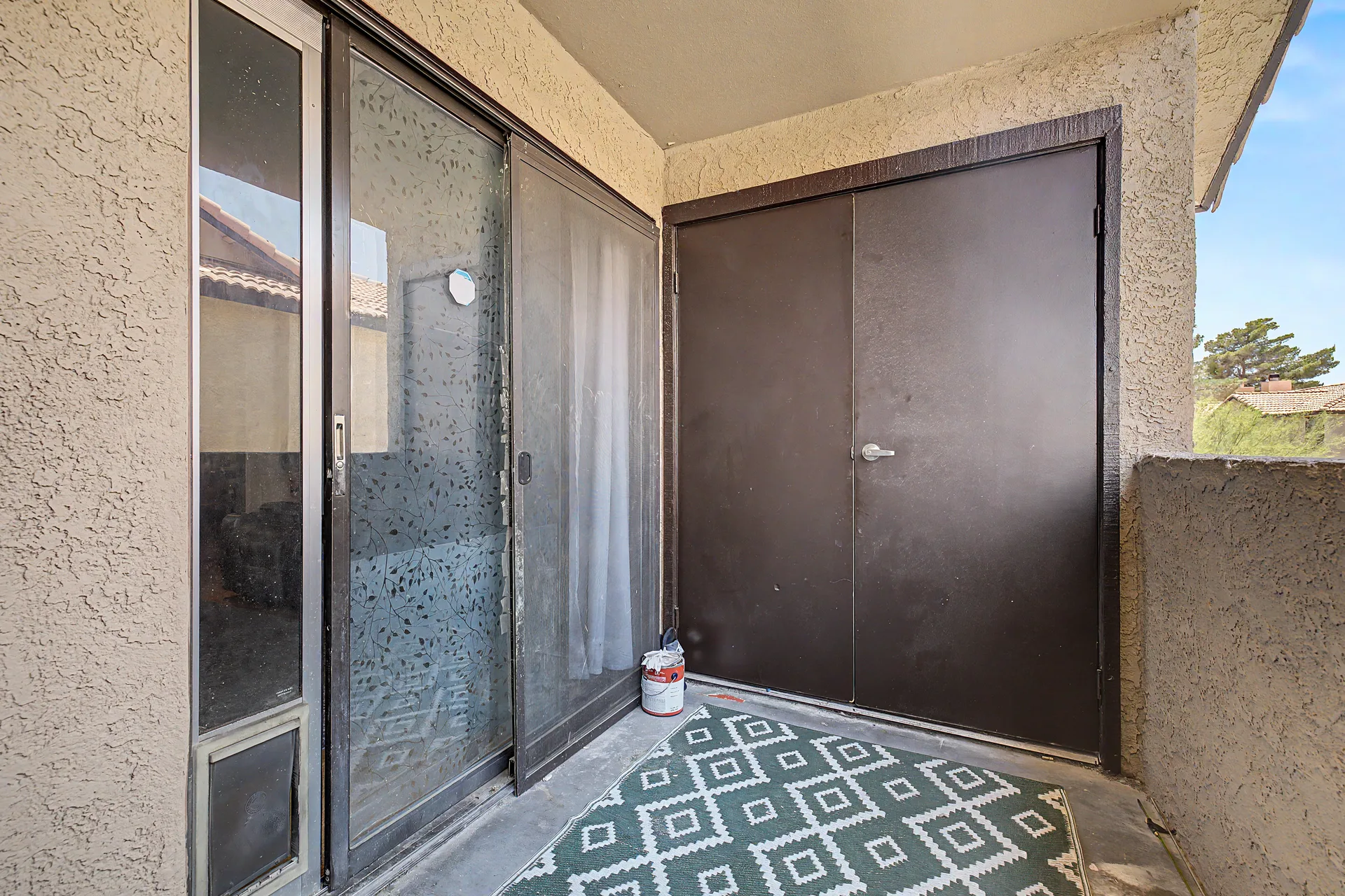 Private balcony patio at the condo with a sliding glass door
