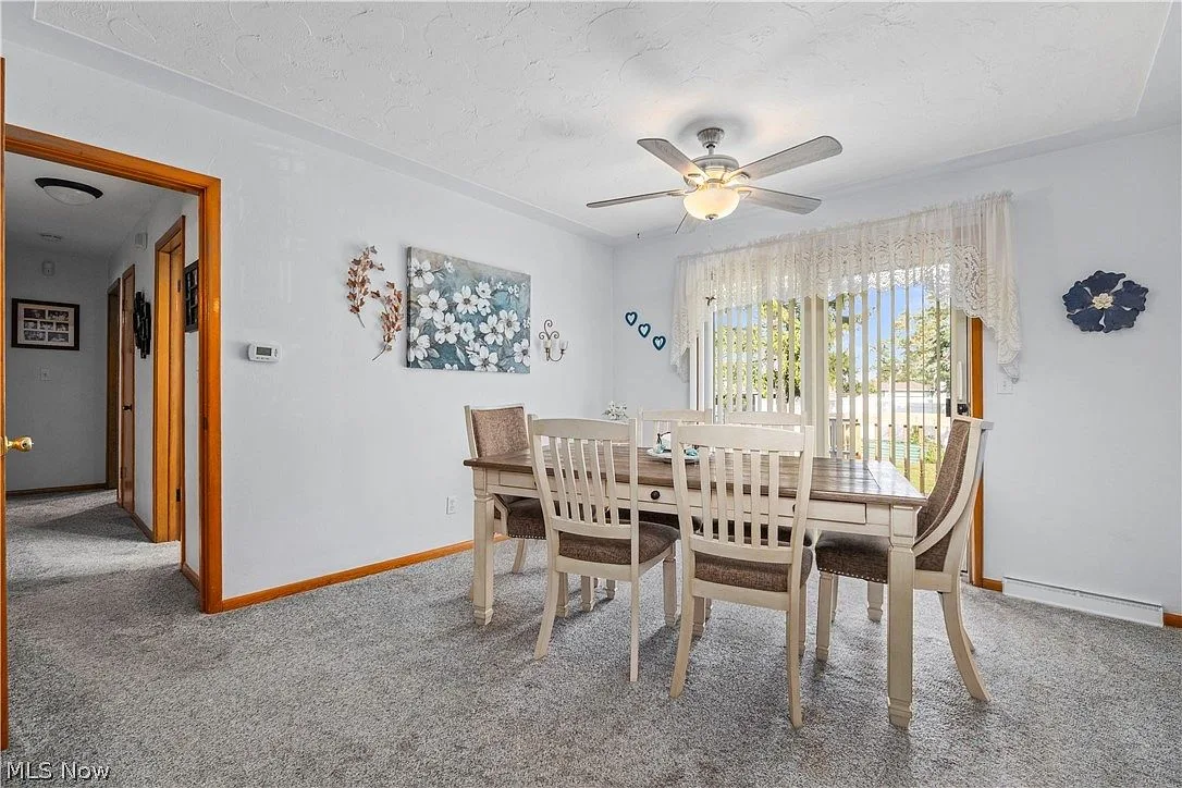 Dining area with natural light from a large sliding glass door
