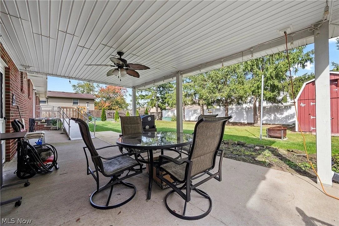 Covered patio with vinyl ceiling behind the home