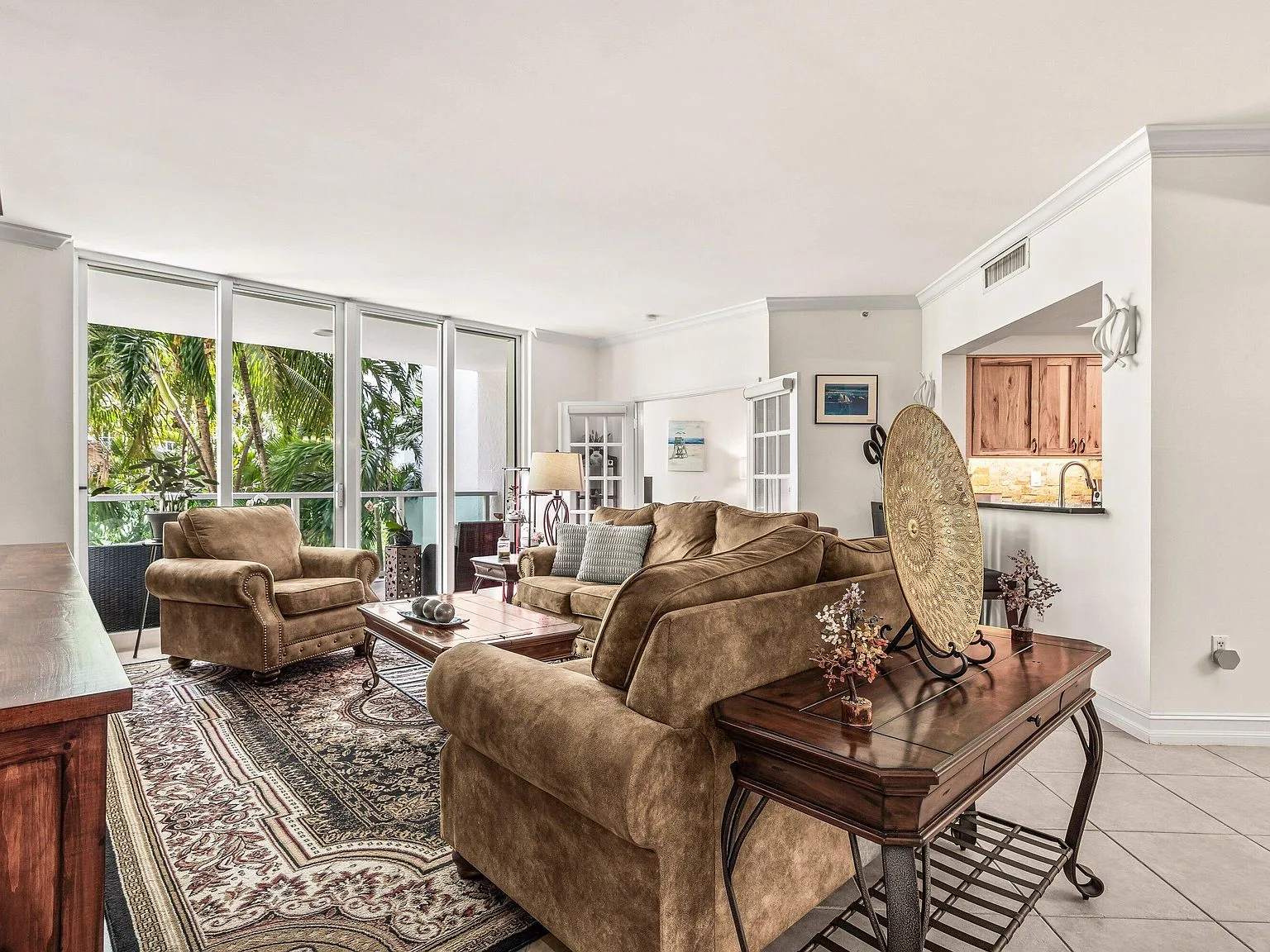 Living room opening to a private balcony at 500 SE Mizner Boulevard #A209, Townsend Place, Boca Raton
