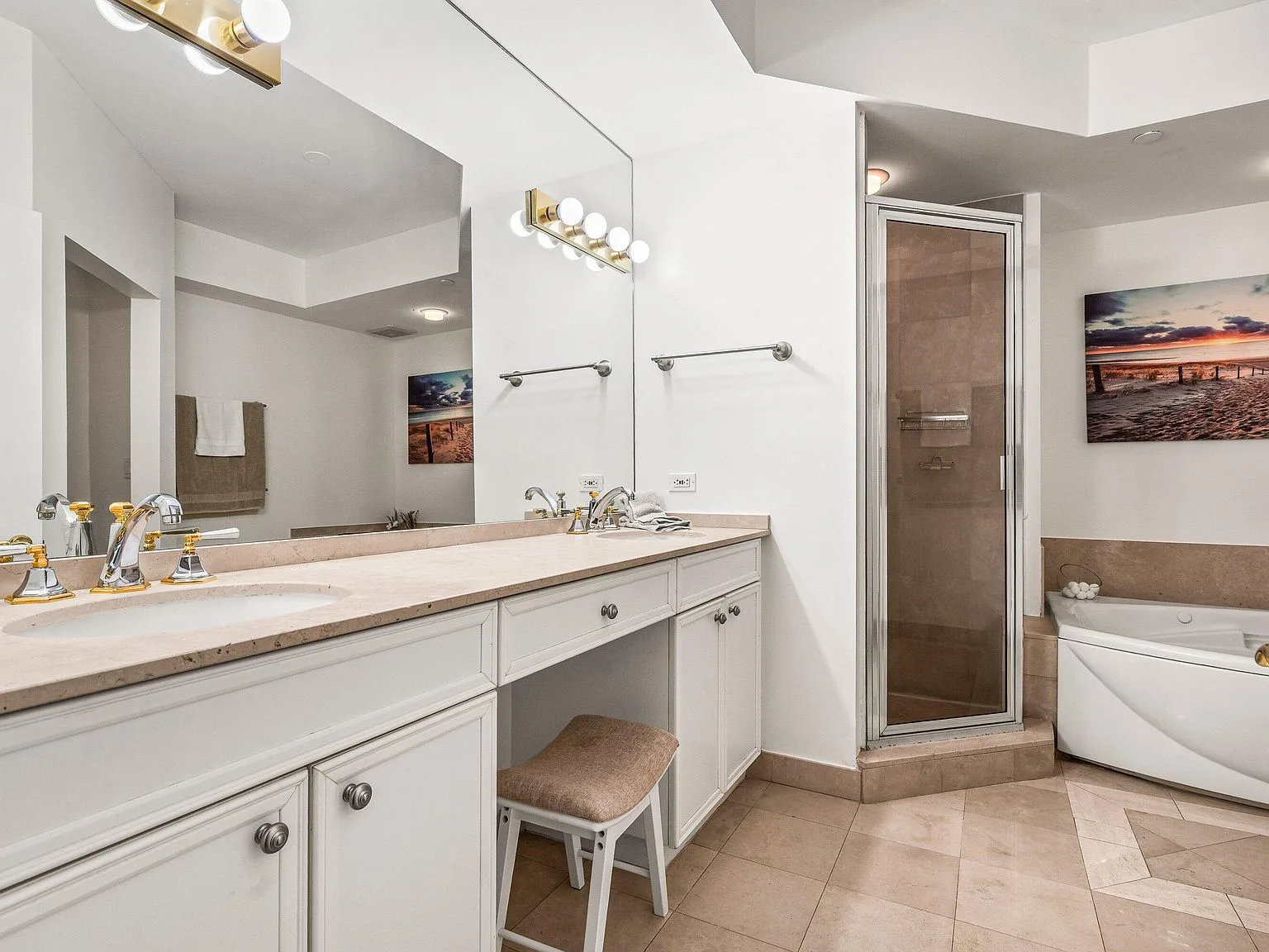 Primary bathroom vanity with dual sinks at the Townsend Place condo
