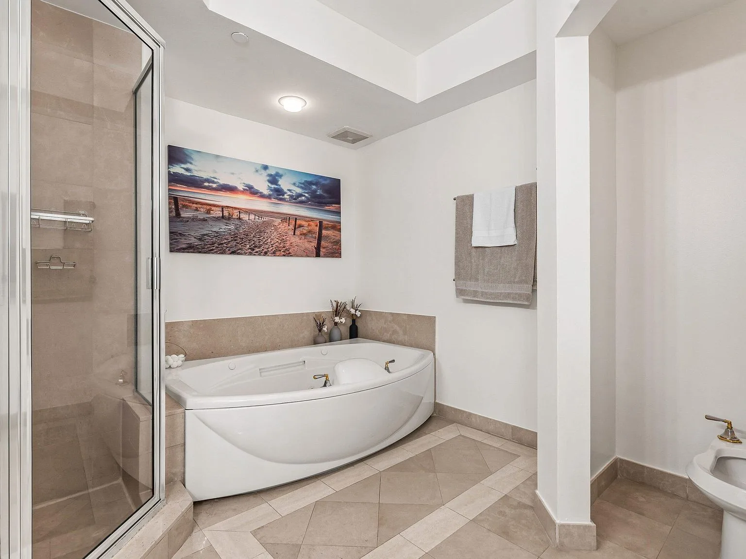 Soaking tub in the primary bathroom at 500 SE Mizner Boulevard #A209