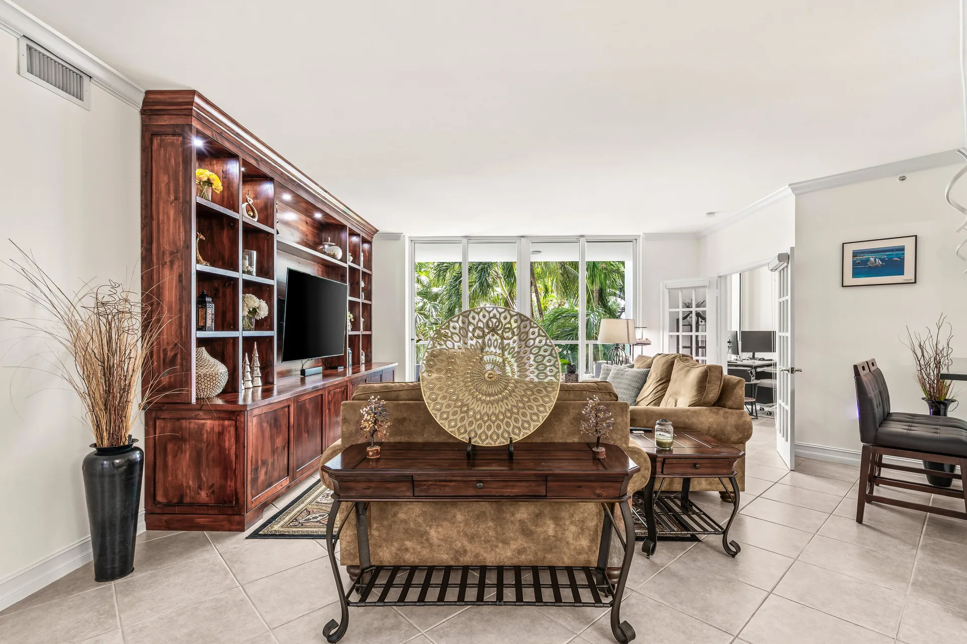 Open-concept living room with floor-to-ceiling windows in a Townsend Place condo at 500 SE Mizner Blvd, Boca Raton