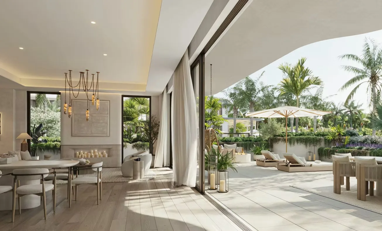 Sala de estar interior-exterior en The Halcyon Residences and Marina que se abre a un patio cubierto