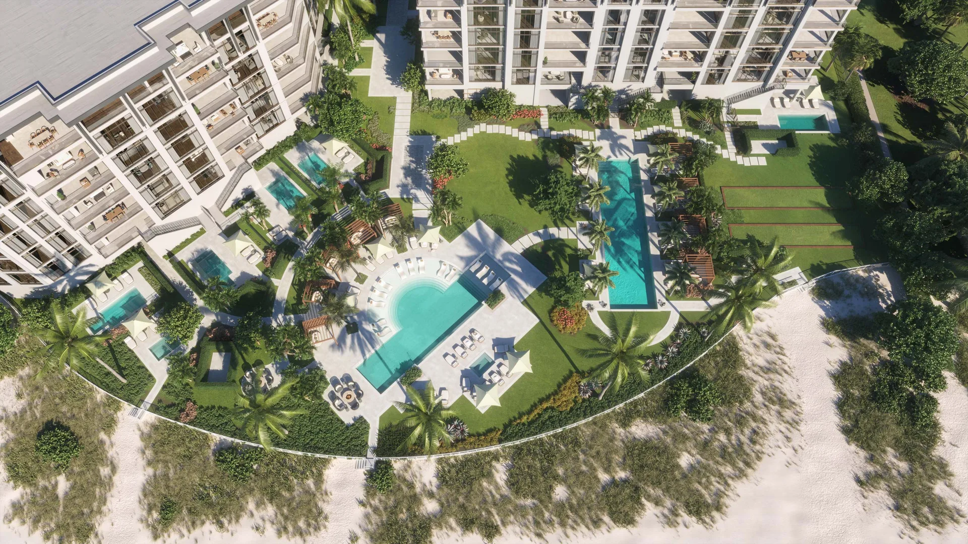 Vista aerea de los jardines frente a la playa de Rosewood Residences Naples con piscinas, cabanas y acceso a la playa del Golfo