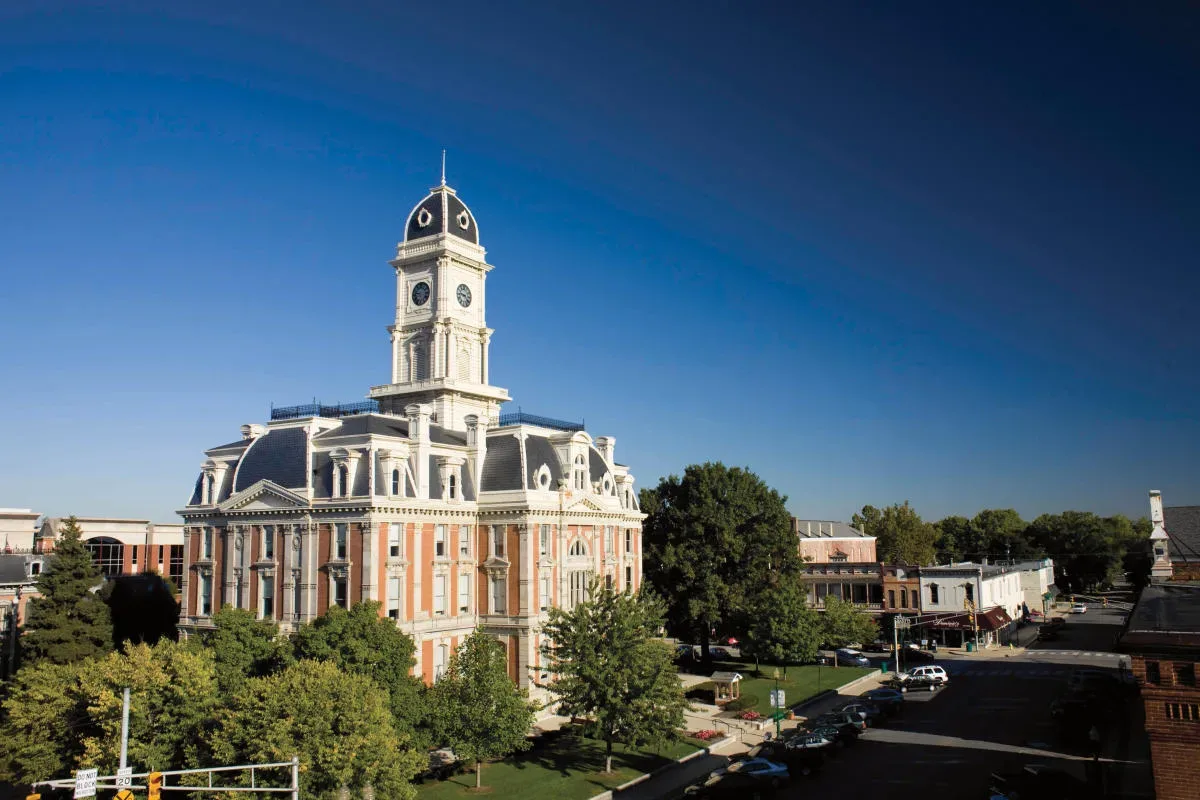 The red brick Hamilton County Courthouse with its central clock tower on the historic Noblesville square