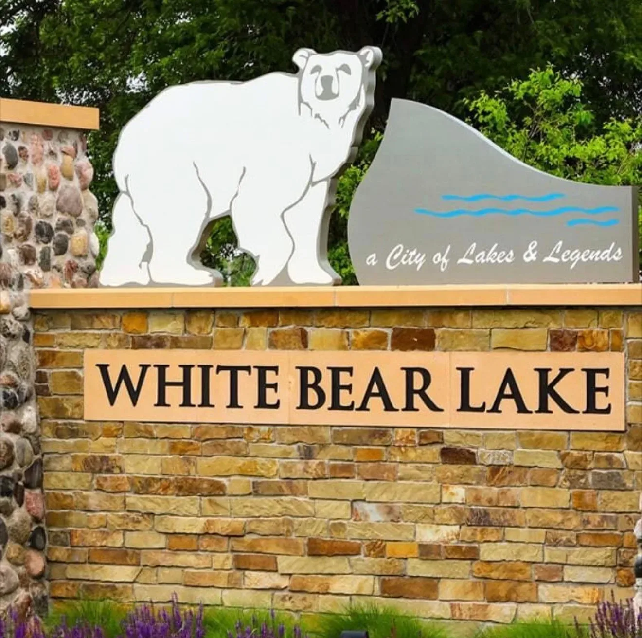White Bear Lake welcome sign with a white bear silhouette