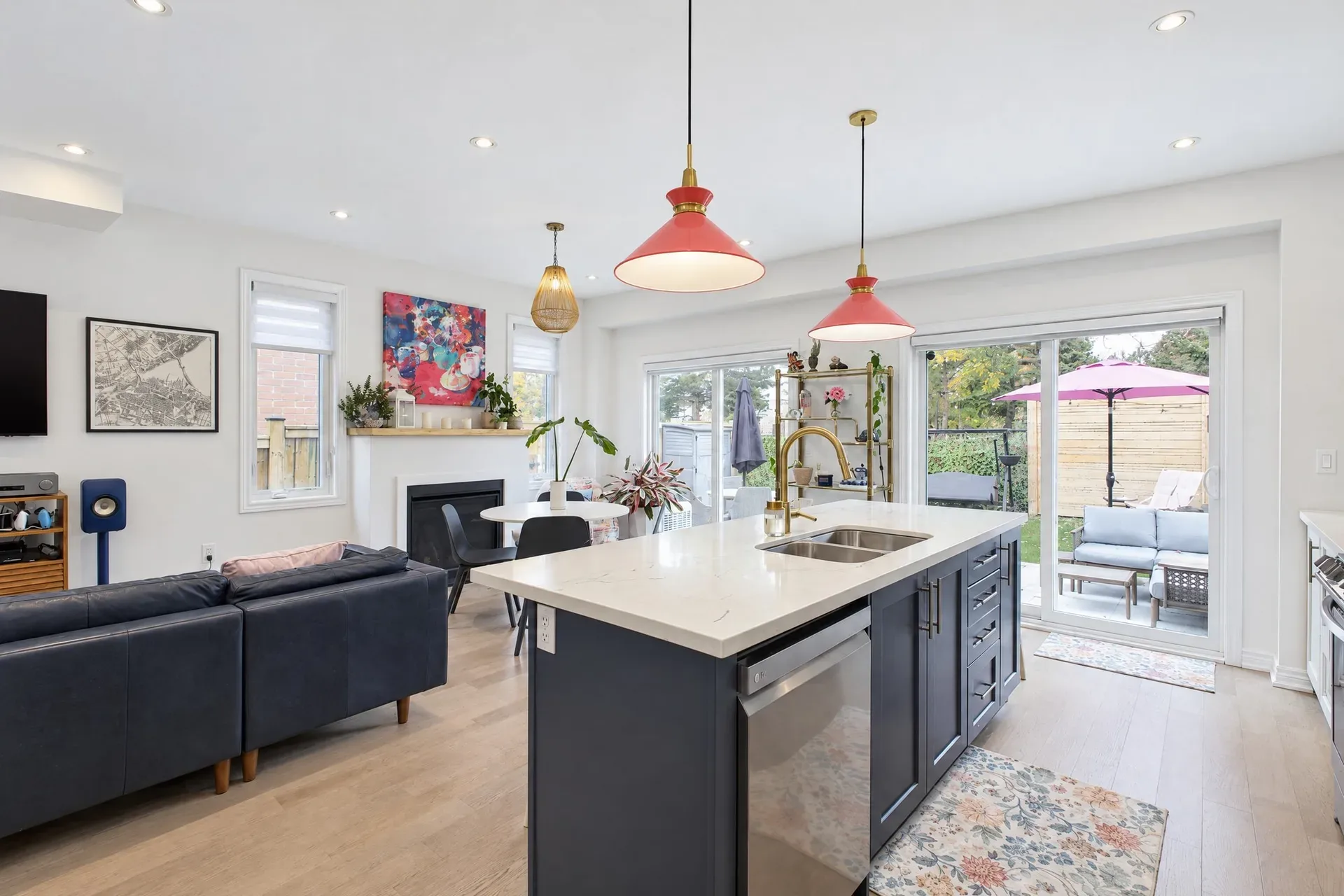 Open-concept kitchen and living: Patio doors pour daylight into the main floor