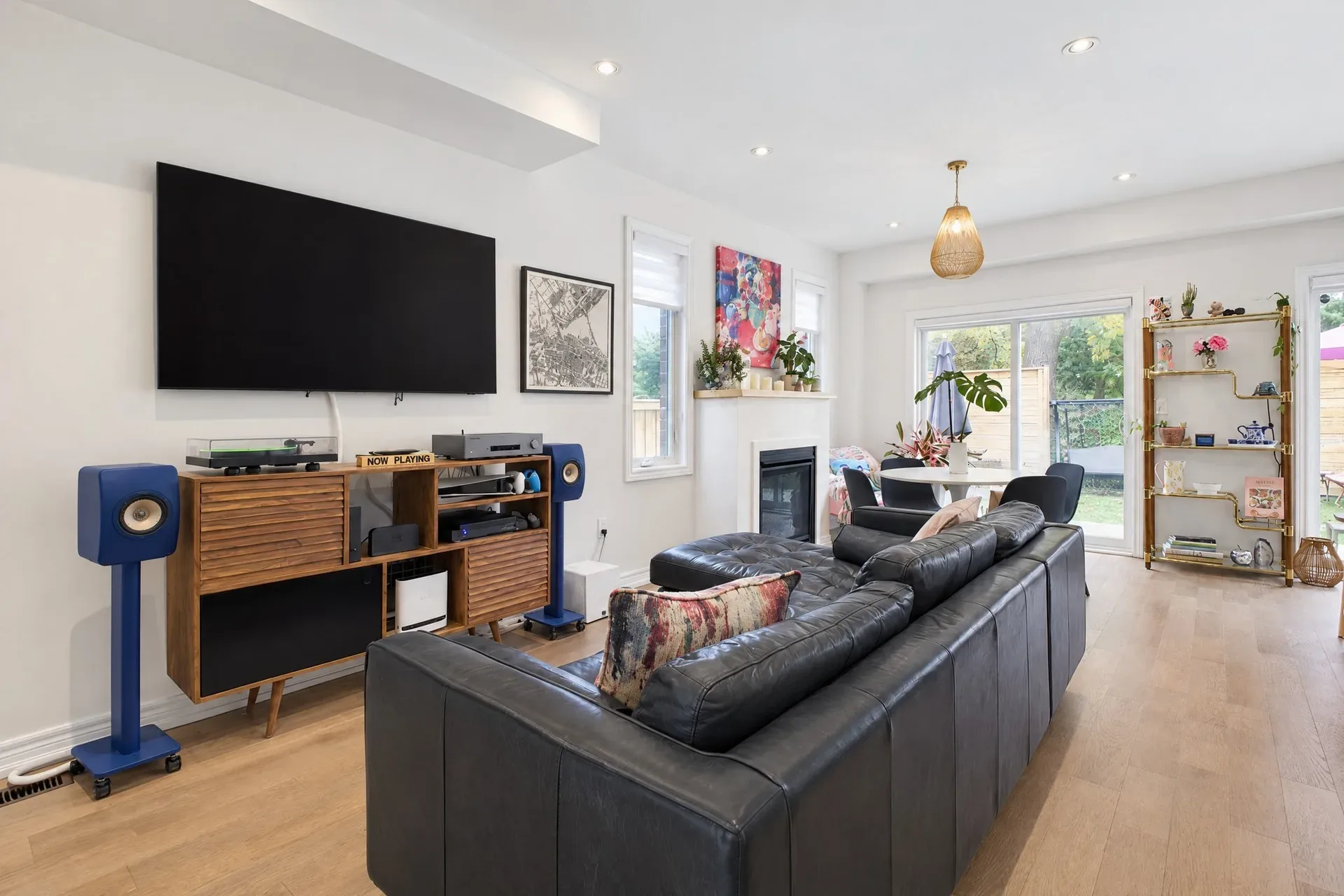Living room with fireplace, wood floors and sliding glass doors