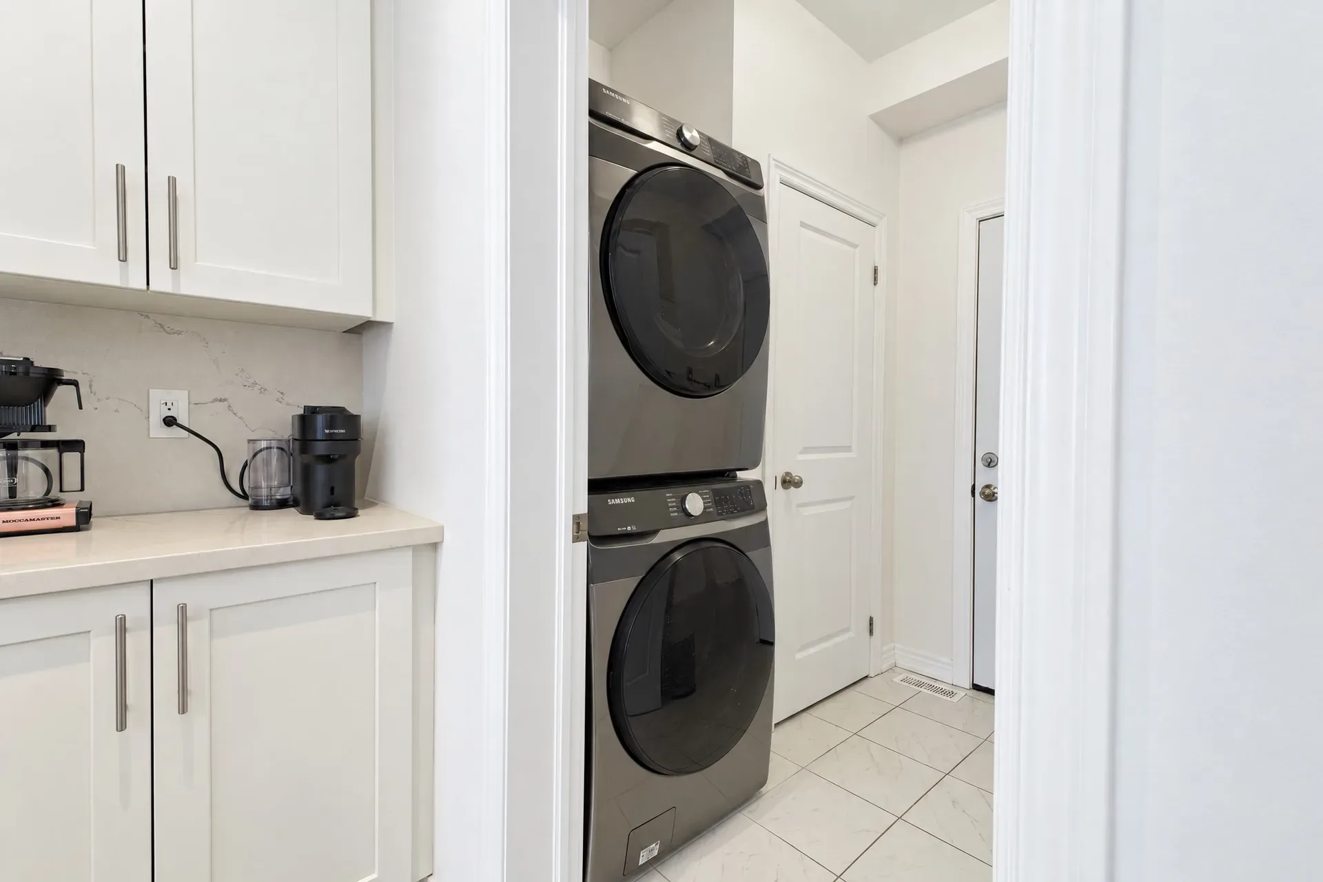Main-floor laundry: Laundry nook with counter and cabinetry