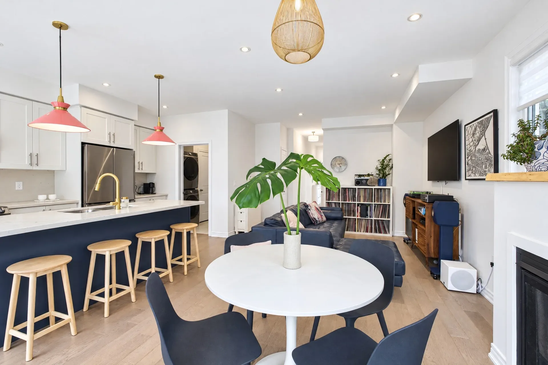 Kitchen and living: Warm wood floors and generous natural light