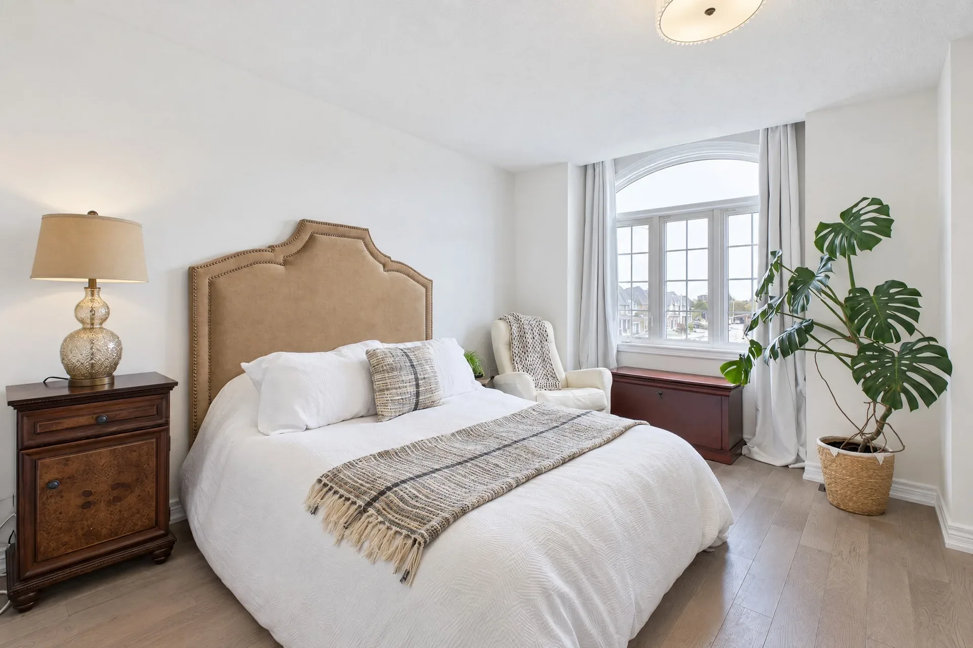 Primary suite details: Warm finishes and daylight