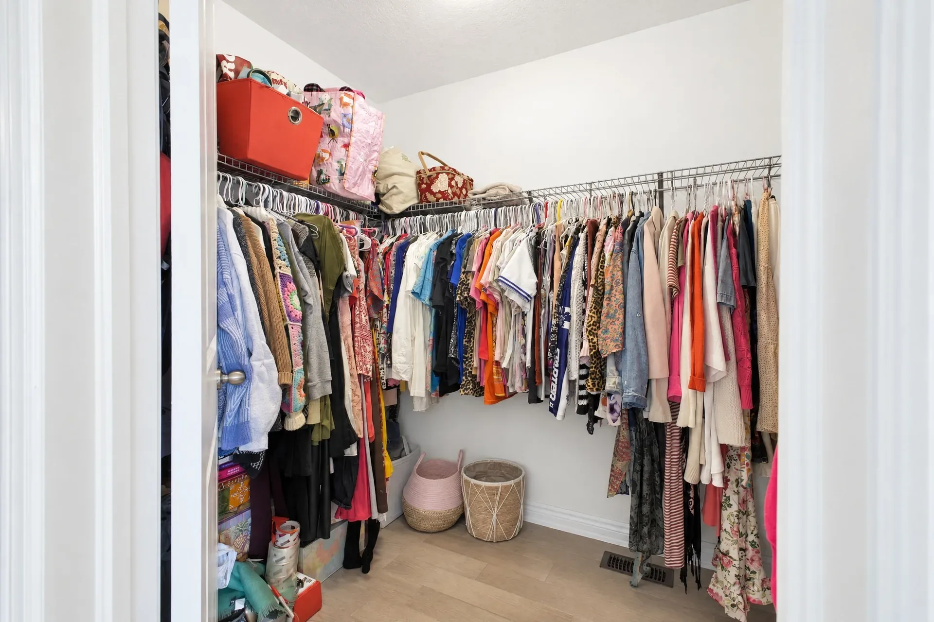 Primary walk-in closet: Wire shelving and generous storage