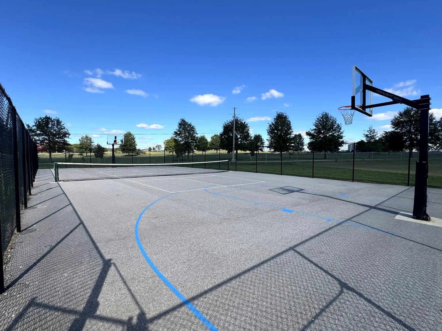 Half basketball and pickleball court at the community recreation area