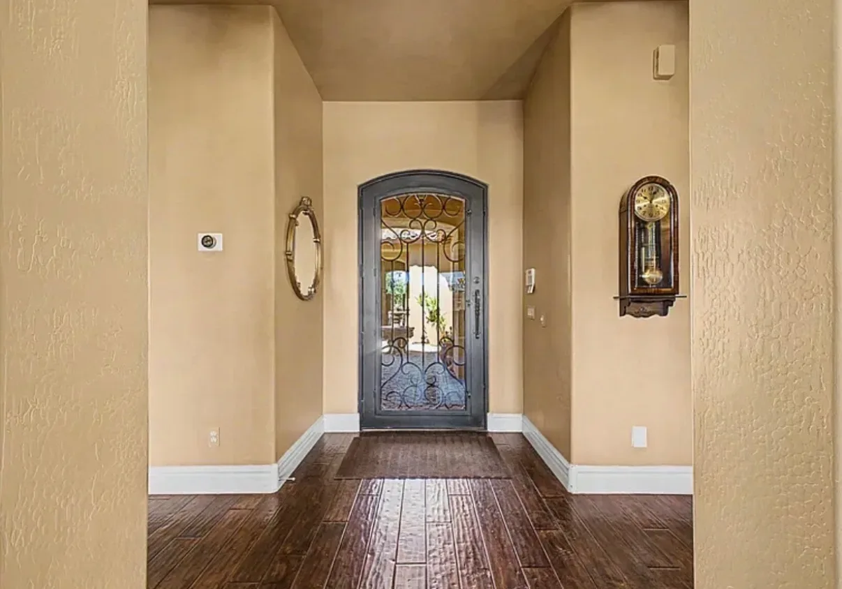 Foyer looking toward the front entrance with wood-look tile flooring