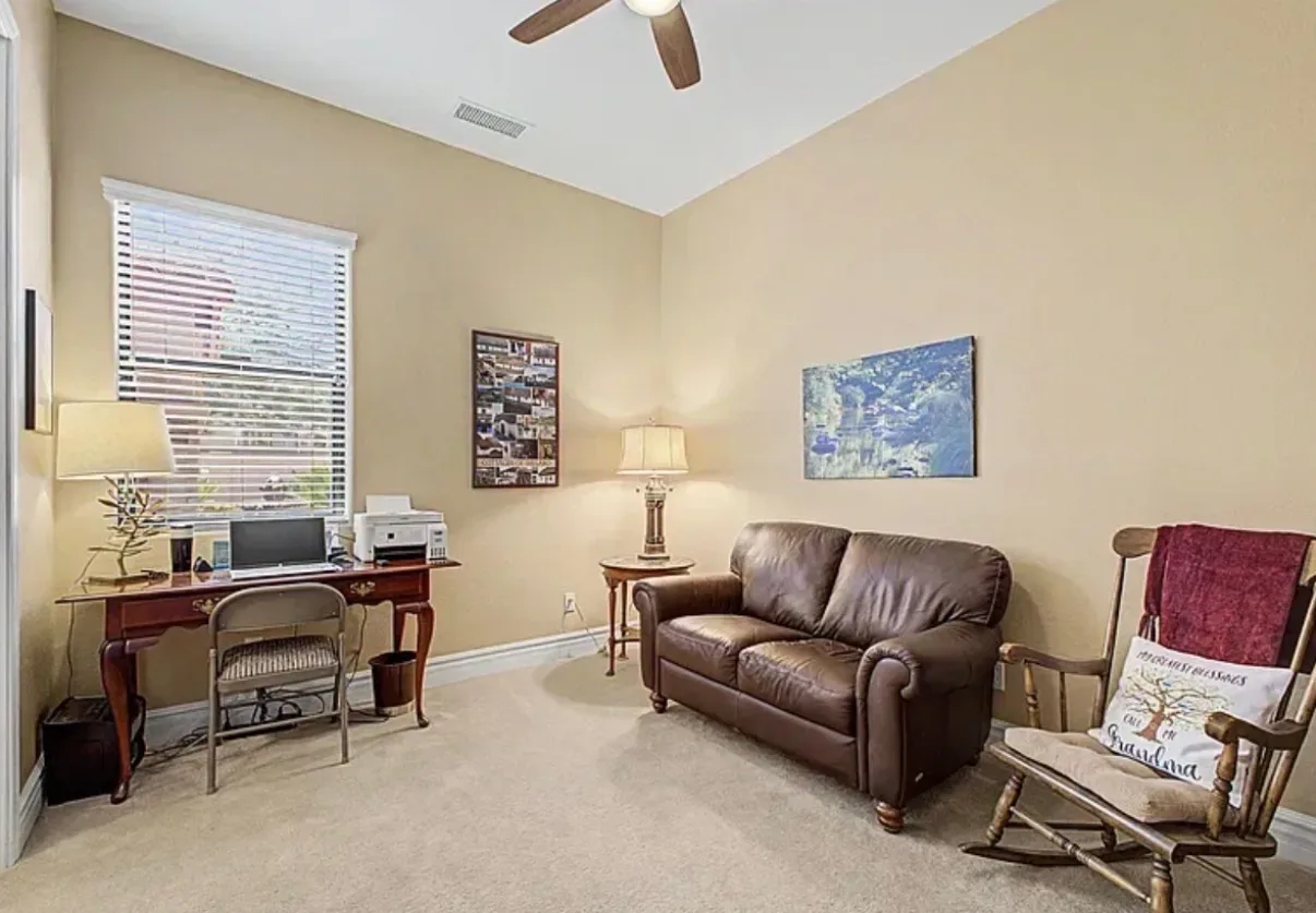 Secondary bedroom arranged as a home office with a desk
