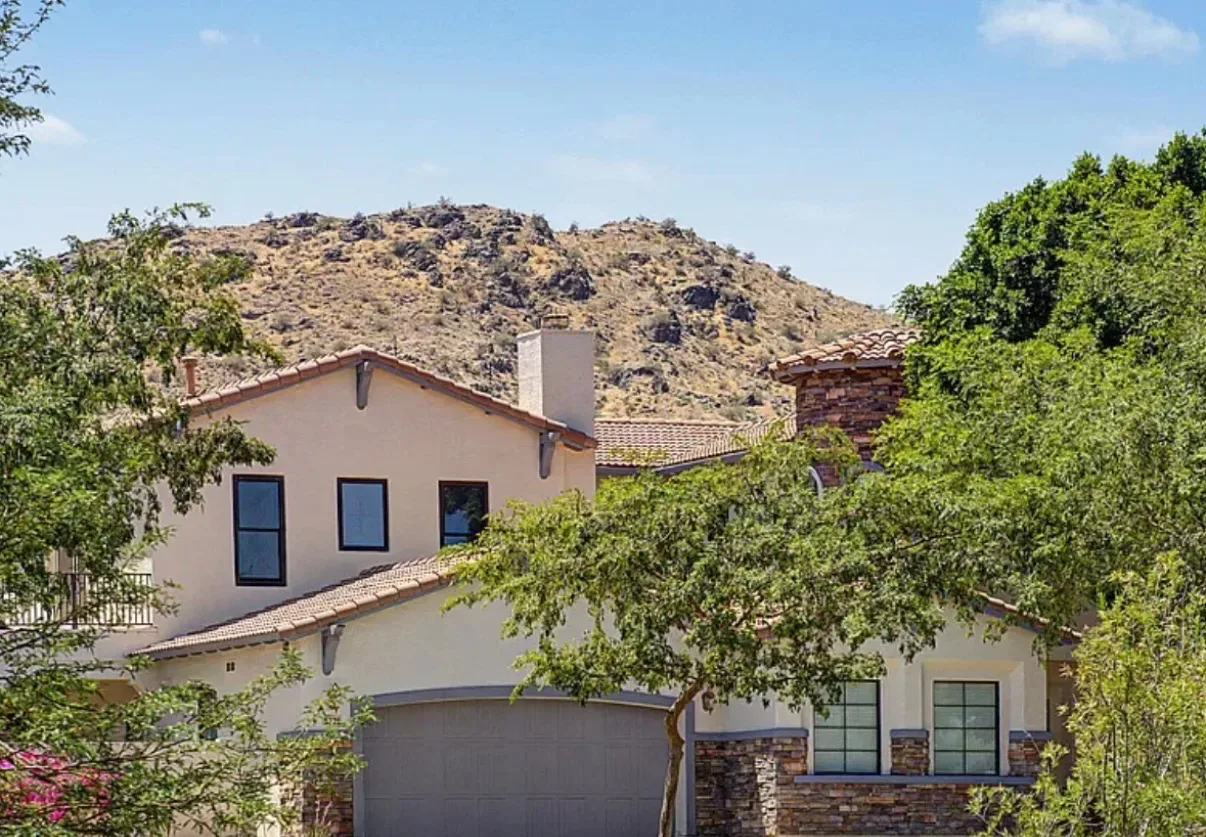 Villa facade with a desert mountain backdrop near South Mountain
