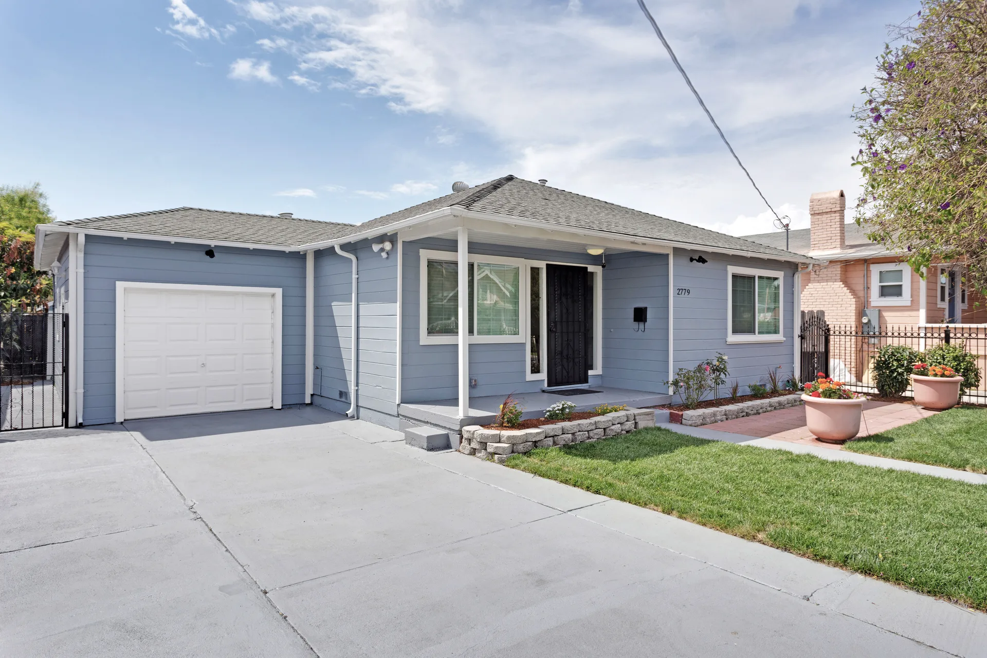 Front exterior of the sold single-story home at 2779 15th St, San Pablo, CA 94806, a blue-painted ranch-style facade with an attached garage.