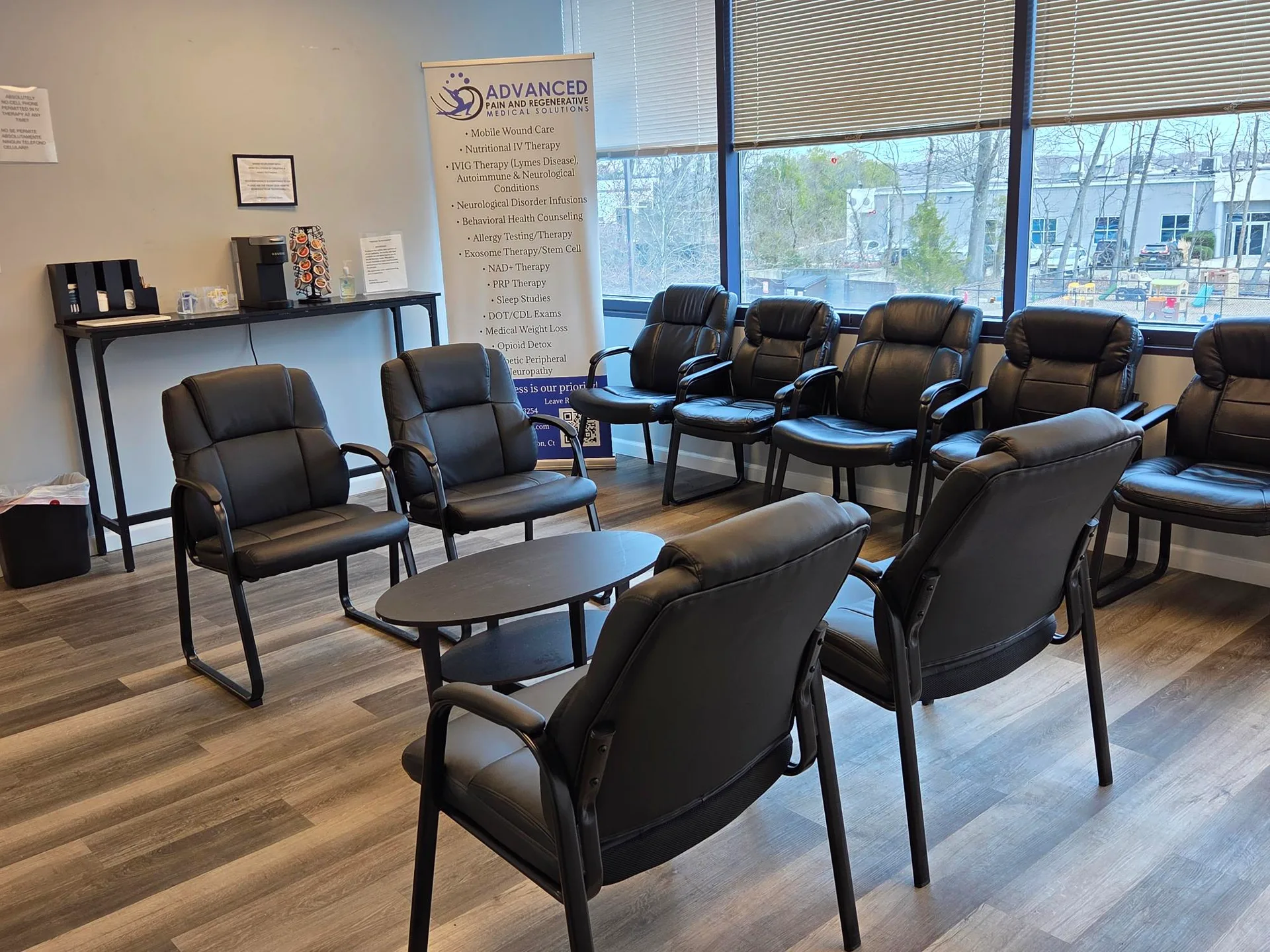 The reception and waiting room at the APRM Solutions office with seating near large windows