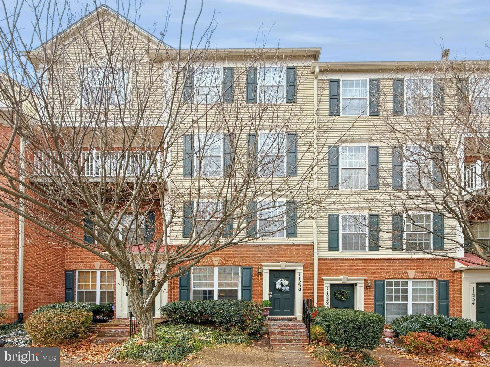 Brick and siding townhouse exterior at 11230 Edson Park Place, Rockville, MD