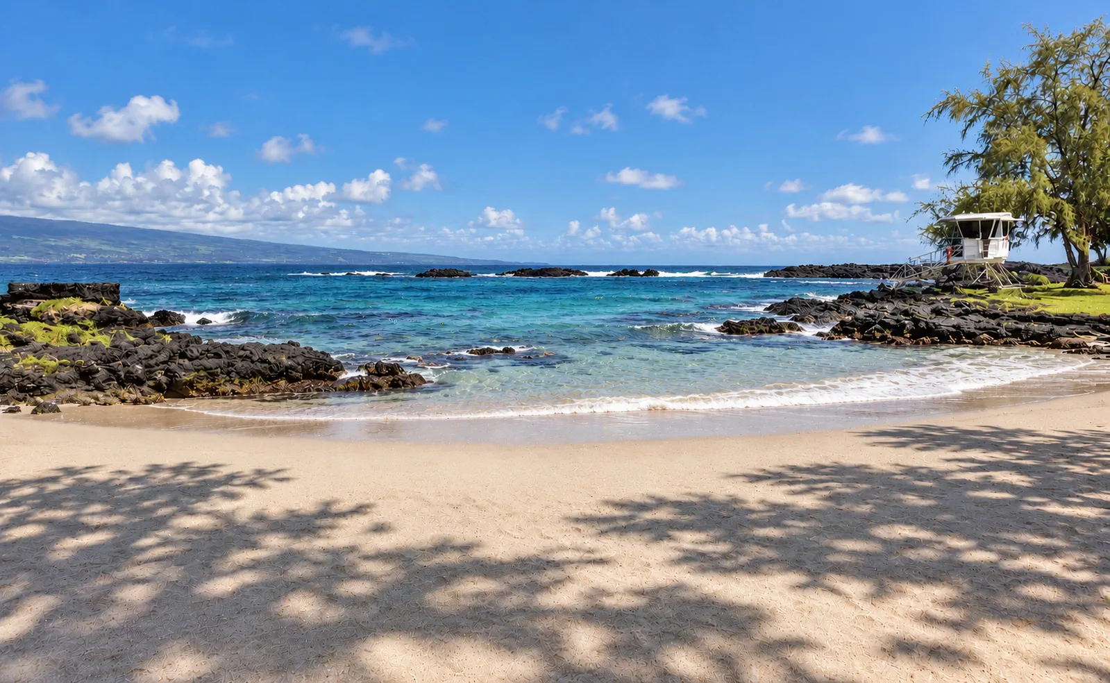 Volcanic shoreline and swimming area at Richardson Ocean Park in Hilo