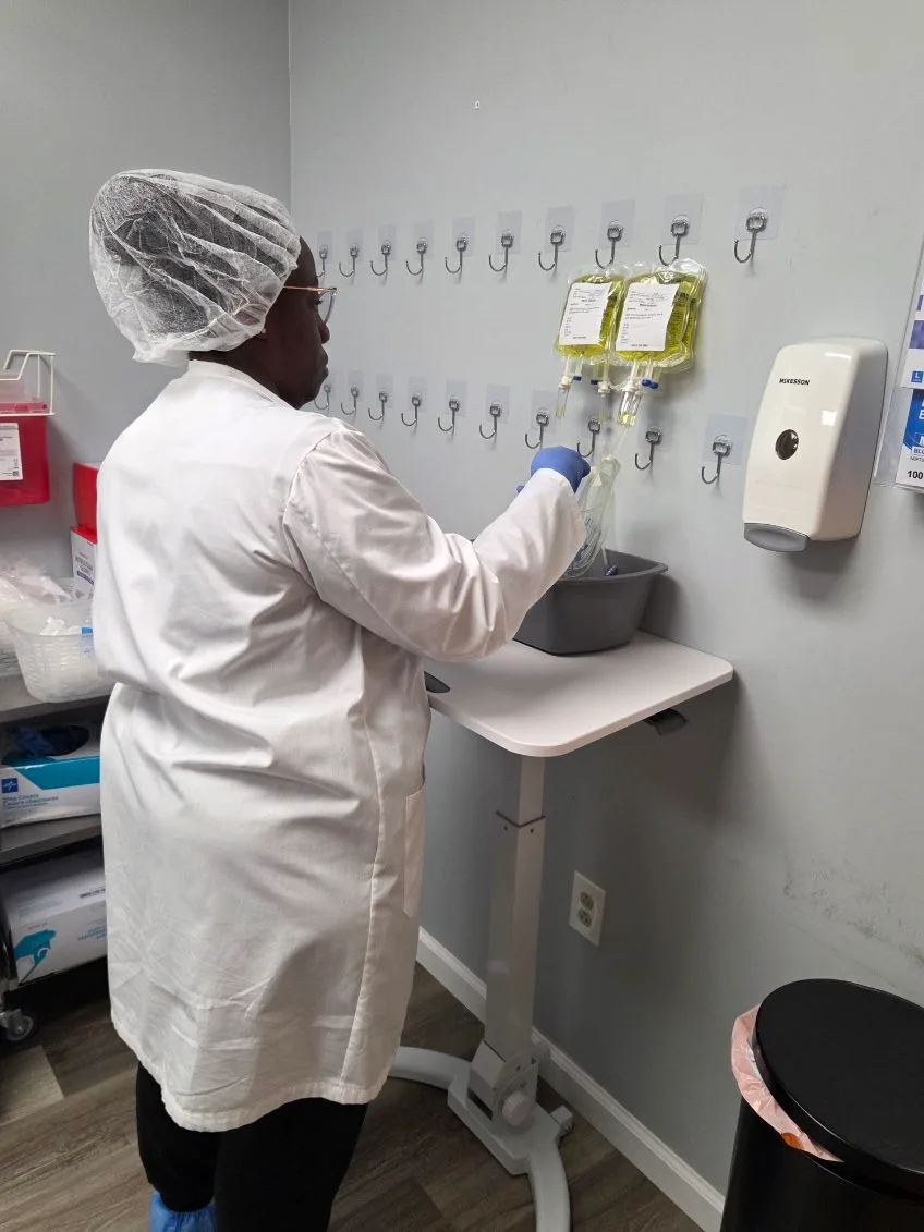A clinician at the APRM Solutions workstation preparing infusion supplies