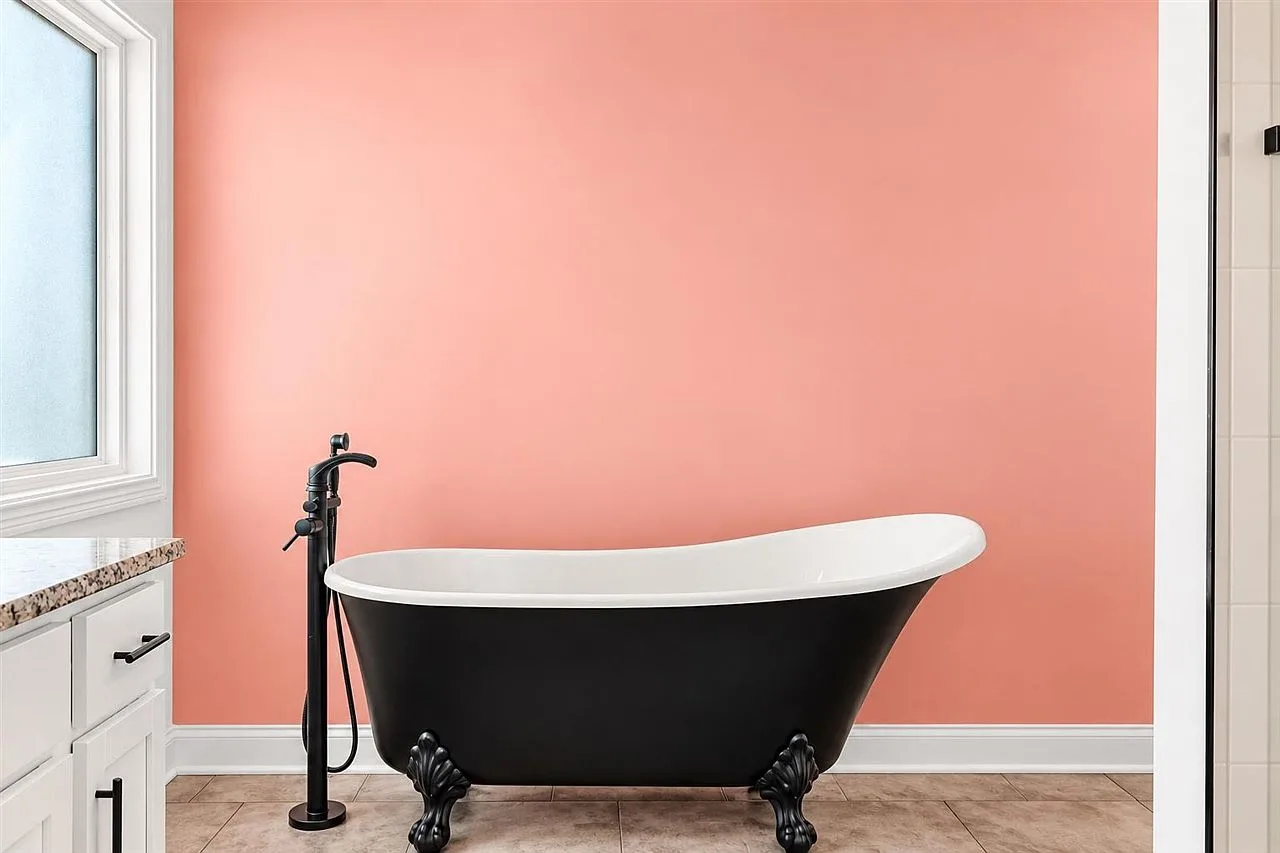 Primary bathroom with a statement black clawfoot soaking tub
