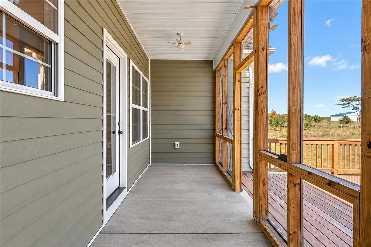 Screened porch at 87 Stone Trace Ct looking out toward the deck