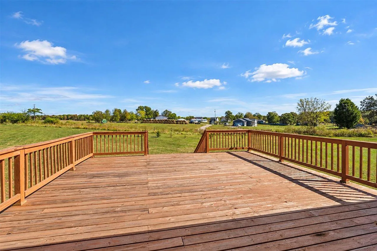 The expansive 20 by 20 deck at 87 Stone Trace Ct leading to the backyard lawn