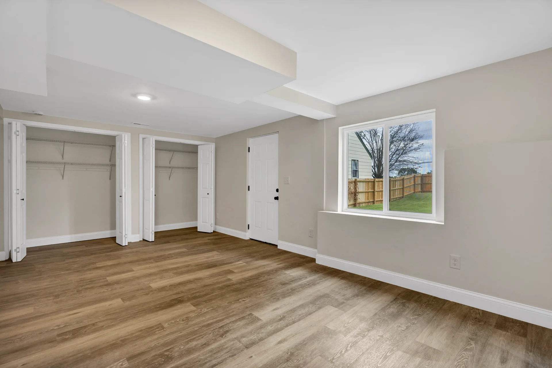 Lower level bedroom with closet doors