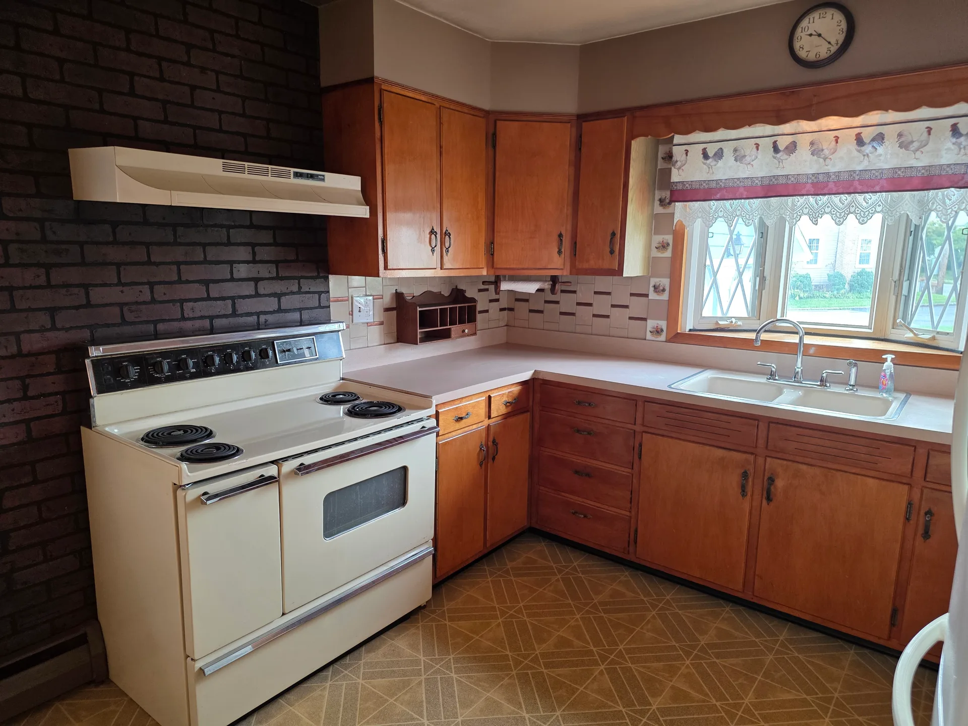 Kitchen with brick accent wall