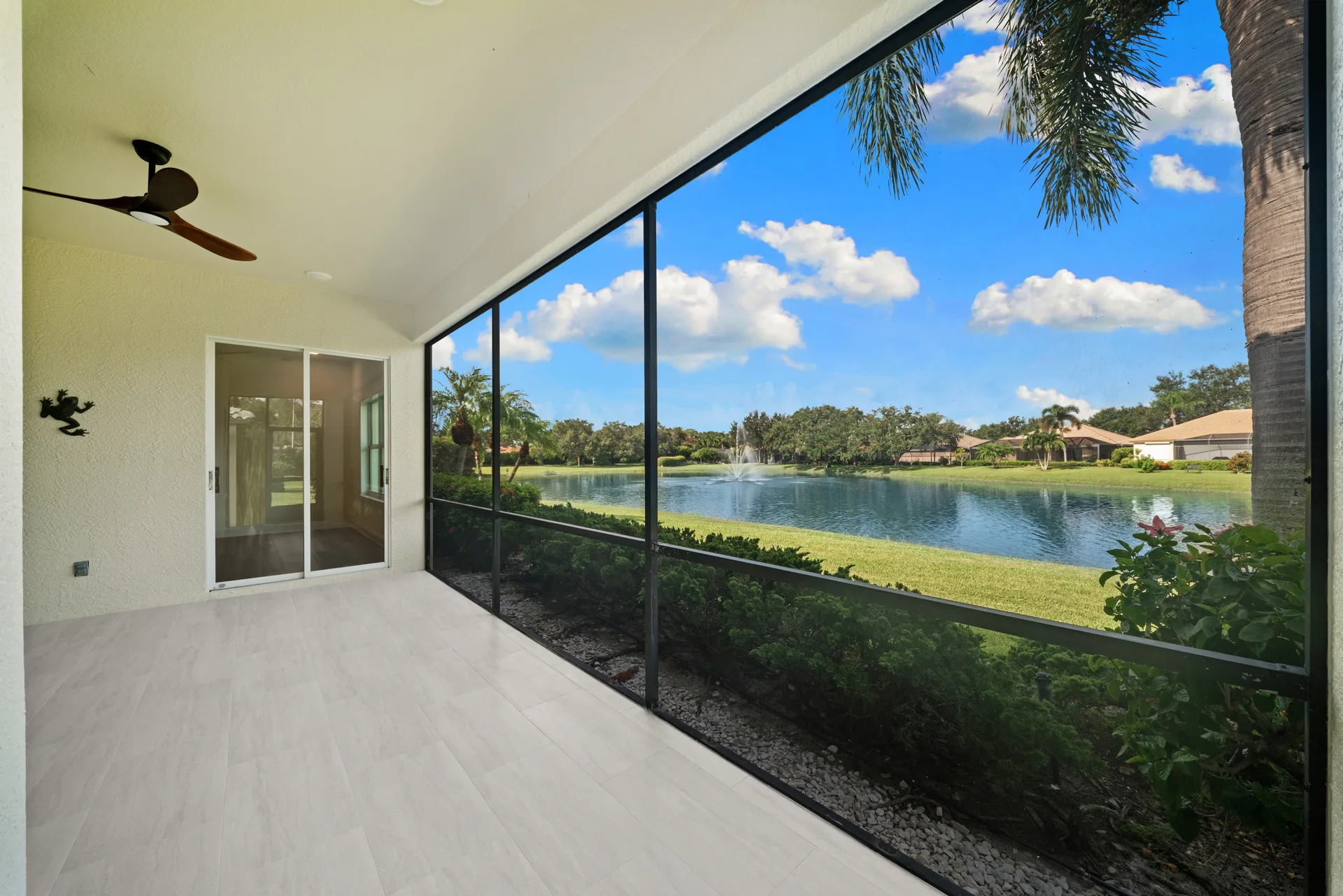 Lanai with clear lake and fountain view