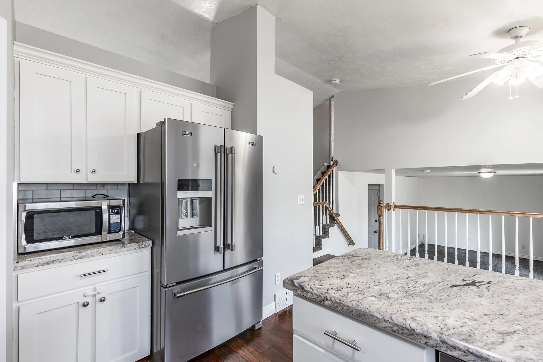 Kitchen with stainless steel appliances and island view